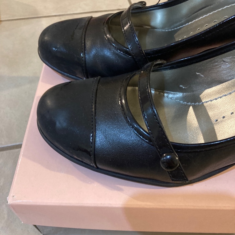 Bandolier black leather Mary Janes